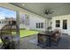 Covered patio features comfortable seating and a view of the lush backyard, perfect for relaxation and entertaining at 1071 Kershaw Dr, Winter Garden, FL 34787