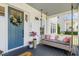 Cozy porch with a swing, plants, and a welcoming entrance at 1071 Kershaw Dr, Winter Garden, FL 34787