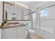 Bathroom with vanity, large mirror, and a glass-enclosed shower at 1084 Park Ridge Cir, Kissimmee, FL 34746