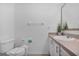 Bathroom featuring a modern vanity, toilet, and towel rack at 1084 Park Ridge Cir, Kissimmee, FL 34746