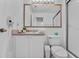 Well-lit bathroom with a large framed mirror, ample countertop space, and a walk-in shower at 1084 Park Ridge Cir, Kissimmee, FL 34746