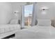 Bright bedroom features two twin beds, natural light, and modern decor at 1084 Park Ridge Cir, Kissimmee, FL 34746