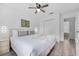 Inviting bedroom featuring a ceiling fan, cozy bed, and en-suite view at 1084 Park Ridge Cir, Kissimmee, FL 34746