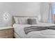 Bright bedroom with a large bed, white linens, and unique Mickey Mouse themed lighting at 1084 Park Ridge Cir, Kissimmee, FL 34746