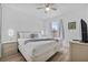 Cozy bedroom with a ceiling fan and a comfortable bed; complete with Mickey Mouse lighting fixtures at 1084 Park Ridge Cir, Kissimmee, FL 34746