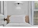 Cozy bedroom featuring a small bed next to a window, illuminated by Mickey Mouse themed sconces at 1084 Park Ridge Cir, Kissimmee, FL 34746
