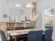 Dining area with modern table set, bar seating and kitchen view at 1084 Park Ridge Cir, Kissimmee, FL 34746