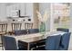 Dining area with modern table set, bar seating and kitchen view at 1084 Park Ridge Cir, Kissimmee, FL 34746