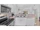 Well-equipped kitchen boasting modern appliances and direct view into dining and living area at 1084 Park Ridge Cir, Kissimmee, FL 34746