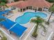 Aerial view of a community pool with ample seating and shade at 1084 Park Ridge Cir, Kissimmee, FL 34746