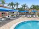 Community pool with plenty of tables, chairs, and lounging areas at 1084 Park Ridge Cir, Kissimmee, FL 34746