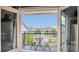Balcony with a table, chairs, and wrought iron railing overlooking the neighborhood at 13125 Alderley Dr, Orlando, FL 32832