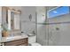 Modern bathroom with a glass-enclosed shower, granite countertop sink, and stylish fixtures at 13125 Alderley Dr, Orlando, FL 32832