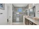 Bathroom featuring granite countertops, modern fixtures, and a walk-in shower at 13125 Alderley Dr, Orlando, FL 32832