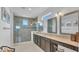 Bathroom with a walk-in shower, dual sinks, granite countertops, and picture window at 13125 Alderley Dr, Orlando, FL 32832