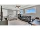 A large bedroom features a ceiling fan, and multiple windows for natural light at 13125 Alderley Dr, Orlando, FL 32832