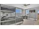 A cozy bedroom featuring a stylish bunk bed, desk, and a unique basketball hoop setup at 13125 Alderley Dr, Orlando, FL 32832