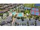 Overhead angle shows the community pool, tennis courts, parking, and clubhouse at 13125 Alderley Dr, Orlando, FL 32832