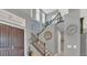 Two-story entryway featuring a staircase and dark-stained wood door at 13125 Alderley Dr, Orlando, FL 32832