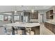 Kitchen with a large center island, breakfast bar, and stainless steel appliances, perfect for entertaining at 13125 Alderley Dr, Orlando, FL 32832