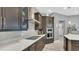 Kitchen features stainless appliances, quartz countertops, sleek cabinetry, and a modern cooktop at 13125 Alderley Dr, Orlando, FL 32832
