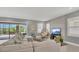 Bright and airy living room with a comfortable sectional, modern decor, and large sliding glass doors at 13125 Alderley Dr, Orlando, FL 32832