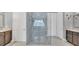 Modern bathroom with a glass walk-in shower and dual vanities with granite countertops at 13125 Alderley Dr, Orlando, FL 32832