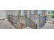 A view of the stairway with decorative railing leading to the lower floor at 13125 Alderley Dr, Orlando, FL 32832