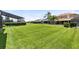 Spacious backyard with lush green grass and a play area, perfect for outdoor activities at 14883 Hartford Run Dr, Orlando, FL 32828