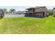 Large backyard featuring lush green grass, a white fence, and plenty of room for outdoor activities at 14883 Hartford Run Dr, Orlando, FL 32828