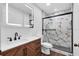 Modern bathroom featuring a sleek vanity, stylish mirror, and beautifully tiled shower at 14883 Hartford Run Dr, Orlando, FL 32828