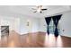 A bedroom with hardwood floors, balcony access and ensuite bathroom at 14883 Hartford Run Dr, Orlando, FL 32828