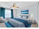 Relaxing Primary bedroom with a plush bed and blue accents at 14883 Hartford Run Dr, Orlando, FL 32828