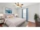 Inviting bedroom with a cozy bed, soft blue accents, and a serene atmosphere at 14883 Hartford Run Dr, Orlando, FL 32828