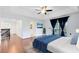 Bright main bedroom featuring wood floors, balcony access and an ensuite bath at 14883 Hartford Run Dr, Orlando, FL 32828