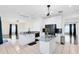 Modern kitchen with black appliances, island, and an open layout at 14883 Hartford Run Dr, Orlando, FL 32828