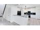 Modern kitchen featuring granite countertops, stainless steel appliances, and white cabinets at 14883 Hartford Run Dr, Orlando, FL 32828