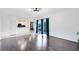 Open-concept living area flows to the kitchen with hardwood floors at 14883 Hartford Run Dr, Orlando, FL 32828