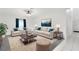 Inviting living room featuring neutral furniture, stylish rug and decor at 14883 Hartford Run Dr, Orlando, FL 32828