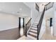 Open-concept living room featuring a staircase and hardwood flooring at 14883 Hartford Run Dr, Orlando, FL 32828