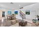 Cozy living room boasts a dining area and an open staircase at 14883 Hartford Run Dr, Orlando, FL 32828