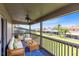 Relaxing porch with wicker furniture overlooking a beautifully maintained lawn and neighborhood at 14883 Hartford Run Dr, Orlando, FL 32828