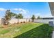Spacious backyard featuring a lush lawn, privacy fence, and well-maintained landscaping at 14925 Lebeau Loop, Winter Garden, FL 34787