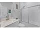 Well-lit bathroom with white cabinets, modern sink, and shower-tub combo, offering style and functionality at 14925 Lebeau Loop, Winter Garden, FL 34787