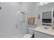 Modern bathroom with a glass-enclosed shower, white subway tile, and a vanity with sleek fixtures at 14925 Lebeau Loop, Winter Garden, FL 34787
