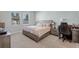 Bedroom featuring carpet, a bed, two windows, and neutral paint, as well as a desk and chair at 14925 Lebeau Loop, Winter Garden, FL 34787