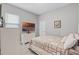 Cozy bedroom with a large TV, dresser, and a comfortable bed, creating a relaxing retreat at 14925 Lebeau Loop, Winter Garden, FL 34787