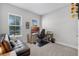 Inviting home office with a comfortable sofa, desk, and bright windows, perfect for productivity at 14925 Lebeau Loop, Winter Garden, FL 34787