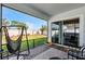 Relaxing screened patio with comfortable seating and a view of the backyard at 14925 Lebeau Loop, Winter Garden, FL 34787