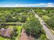 Scenic aerial view showcasing the neighborhood's tree-lined streets and proximity to main roads at 1591 Revere Ln, Daytona Beach, FL 32117